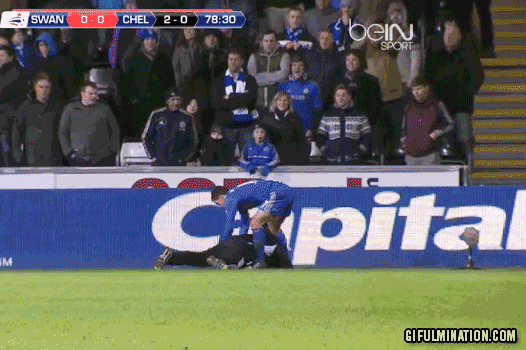 Eden Hazard kicks a ball boy